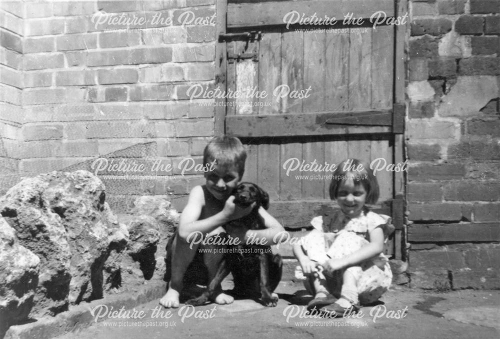 Mary and Bert Elliott in Backyard of 72 Dryden Street, Nottingham, 1957