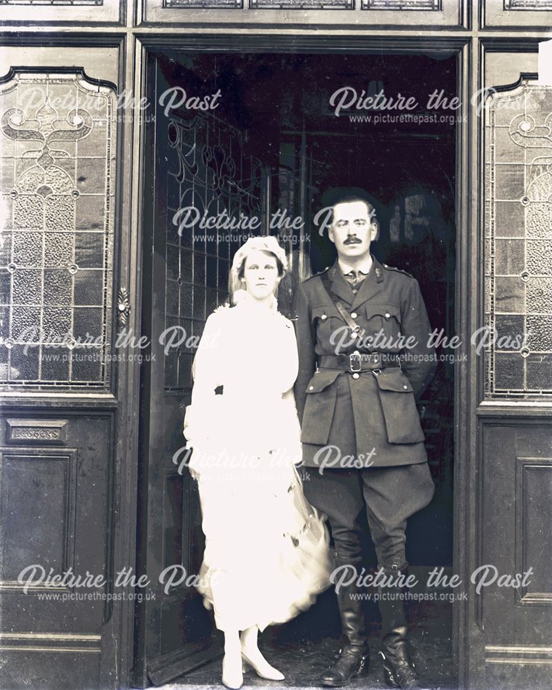 Portrait of an Army Officer and His Wife in Front of Stained Glass Doorway, 1920s