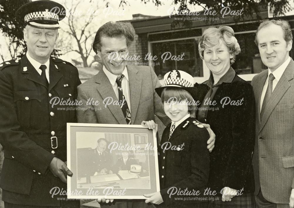 Presentation of framed photograph of Chief Constable Parrish by Dave Gibbs to youngster, Derby, c 19