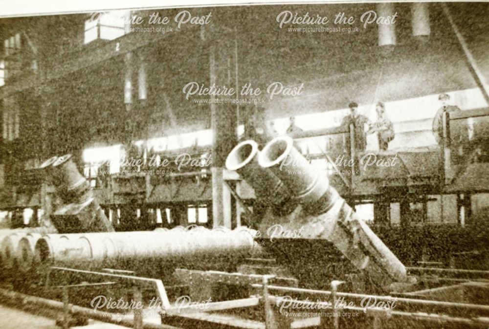 Workers and Pipes in the Sand Spun Plant