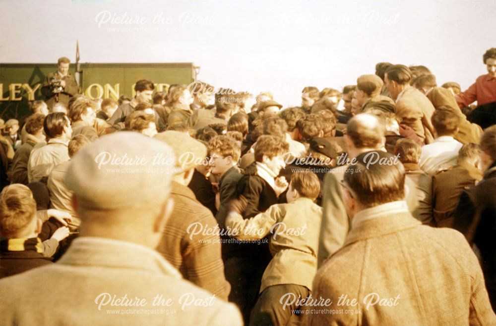 Shrovetide Football Game: The Hug, with players pushing from both sides and the ball in the middle