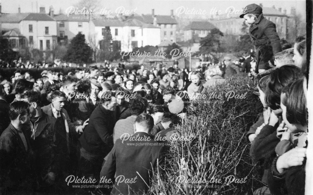 Shrovetide Football Game: The Hug, with players pushing from both sides and the ball in the middle