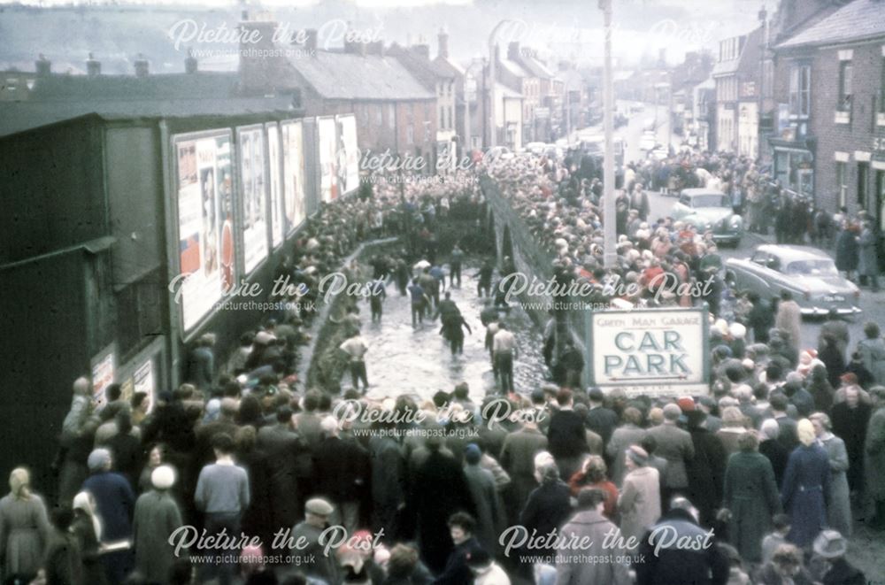 Shrovetide Football Game: the ball has gone in the Henmore (culverted now, site of supermarket)