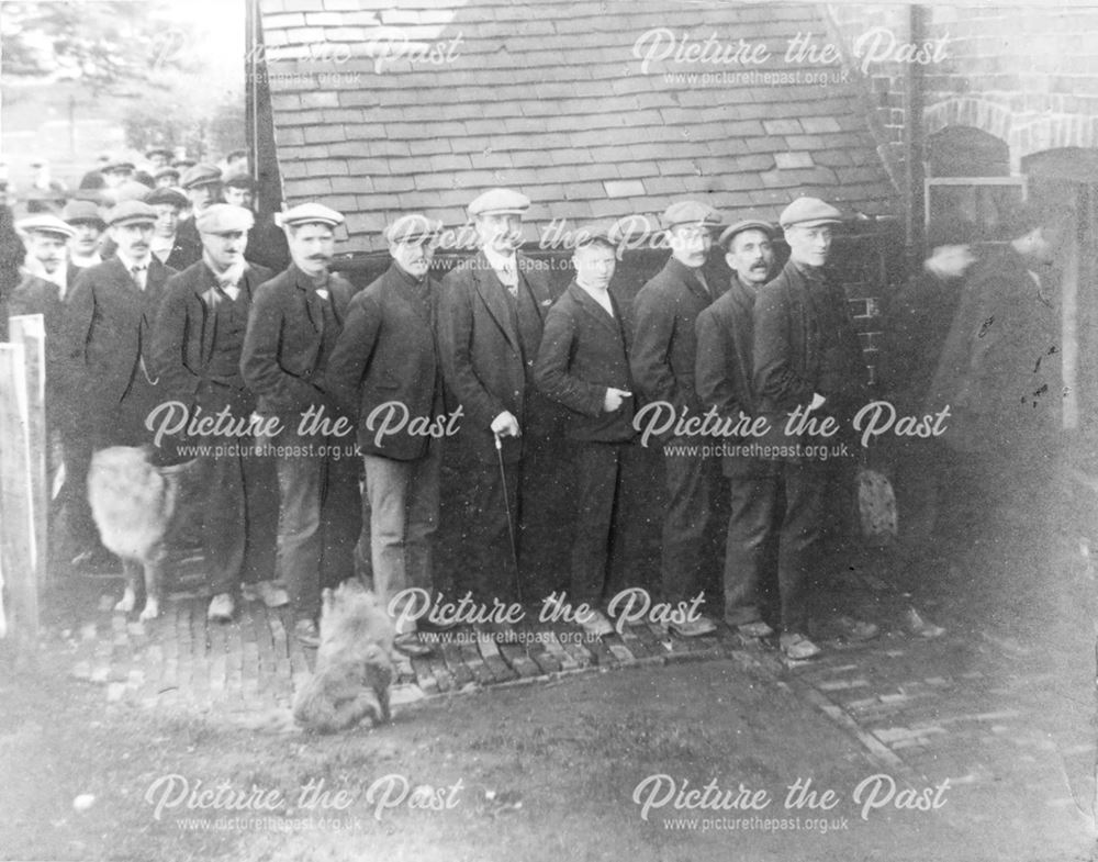 Coal Miners receiving their first strike pay 1912