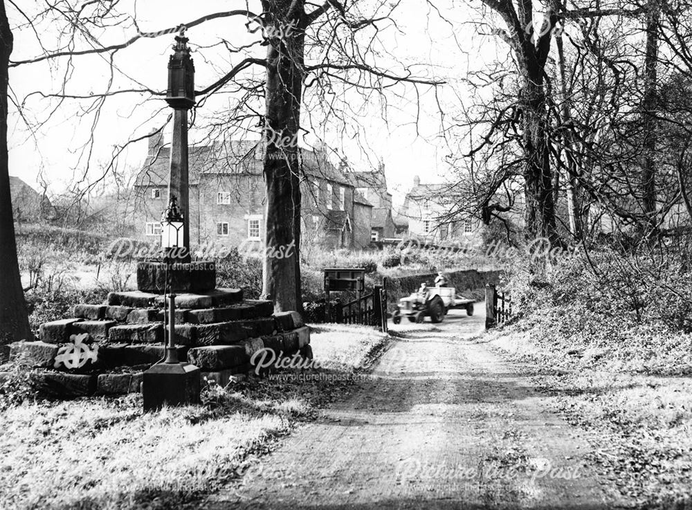 Stone cross in Morley churchyard.