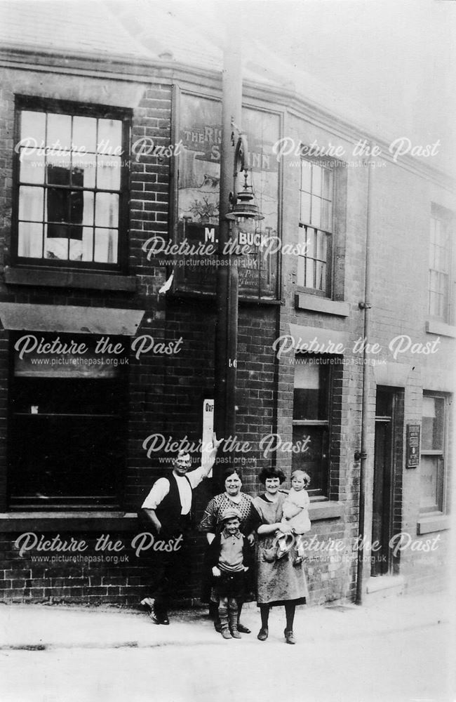 A Family outside The Rising Sun Inn