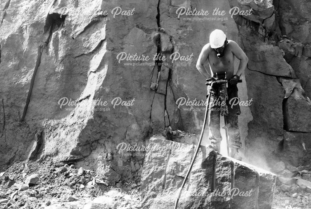 Quarryman drilling stone for splitting