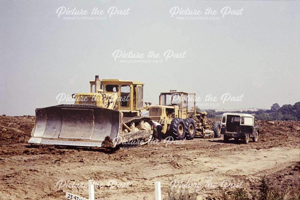 A Caterpillar bulldozer and motor scraper - as Opencast Mining begins at Killamarsh Meadows