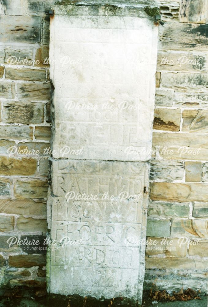 Stone set into the wall of St Peter and Paul church, Eckington