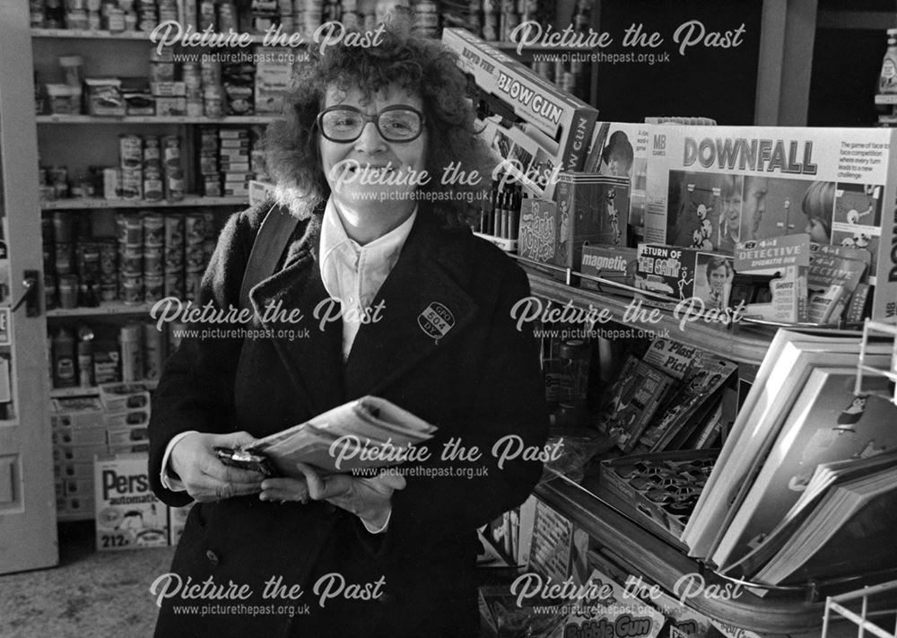 Postwoman inside a Birchwood Lane shop, South Normanton