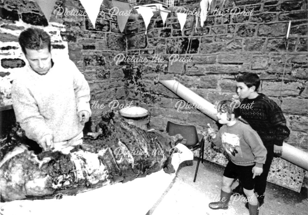 Children intrigued by the hog roast, Fritchley Festival