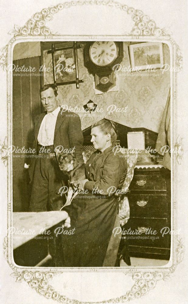 Unknown couple with dog.