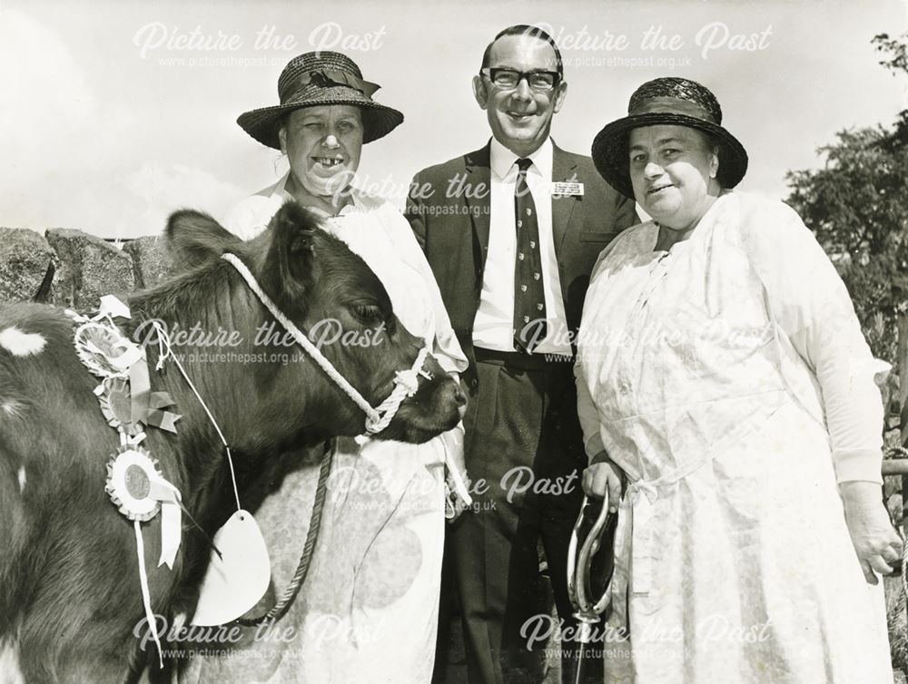 The Misses Robinson with one of their prize winning cows, Ashover Show Ground, c 1950?