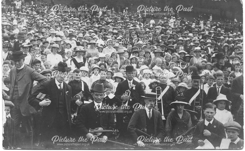 Crowds with musical instruments at a celebration