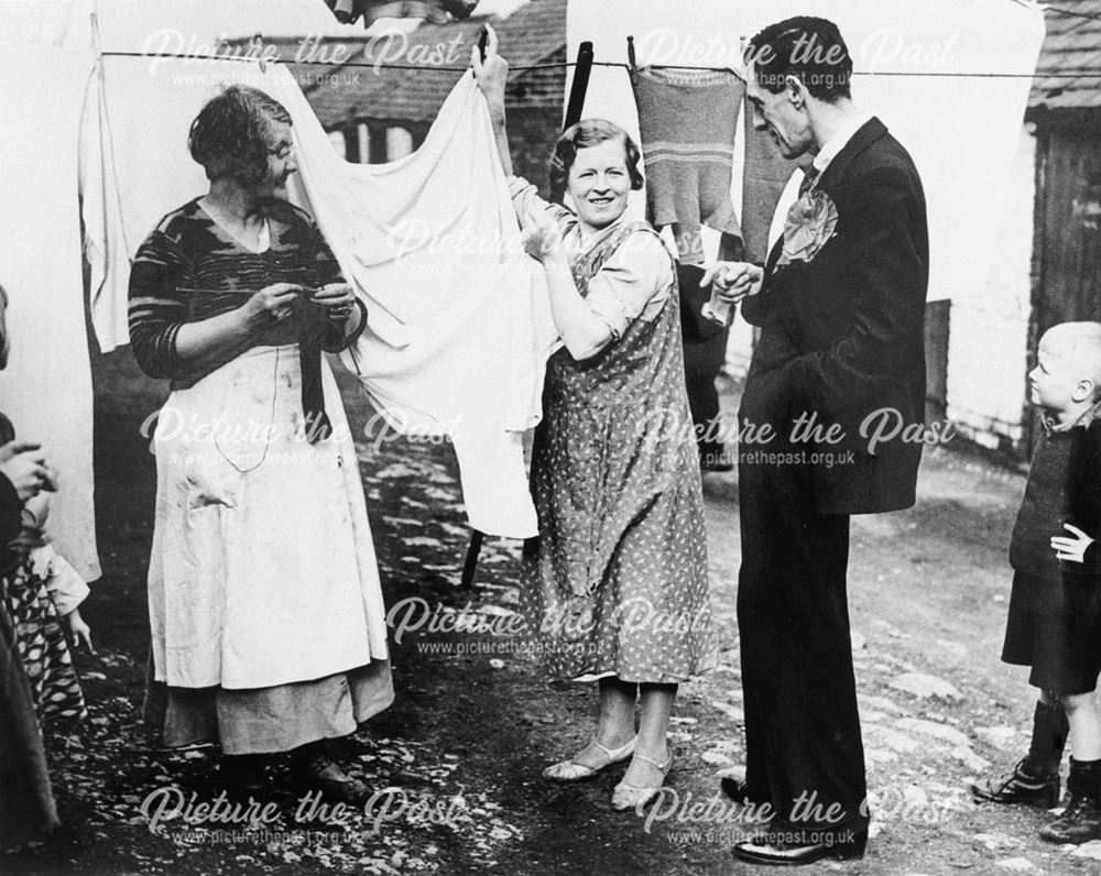 Labour candidate and two lady constituents, Long Row, Clay Cross, October 1936