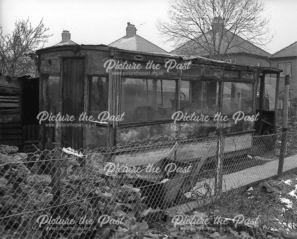 Remains of an electric tramcar in use as a garden shed