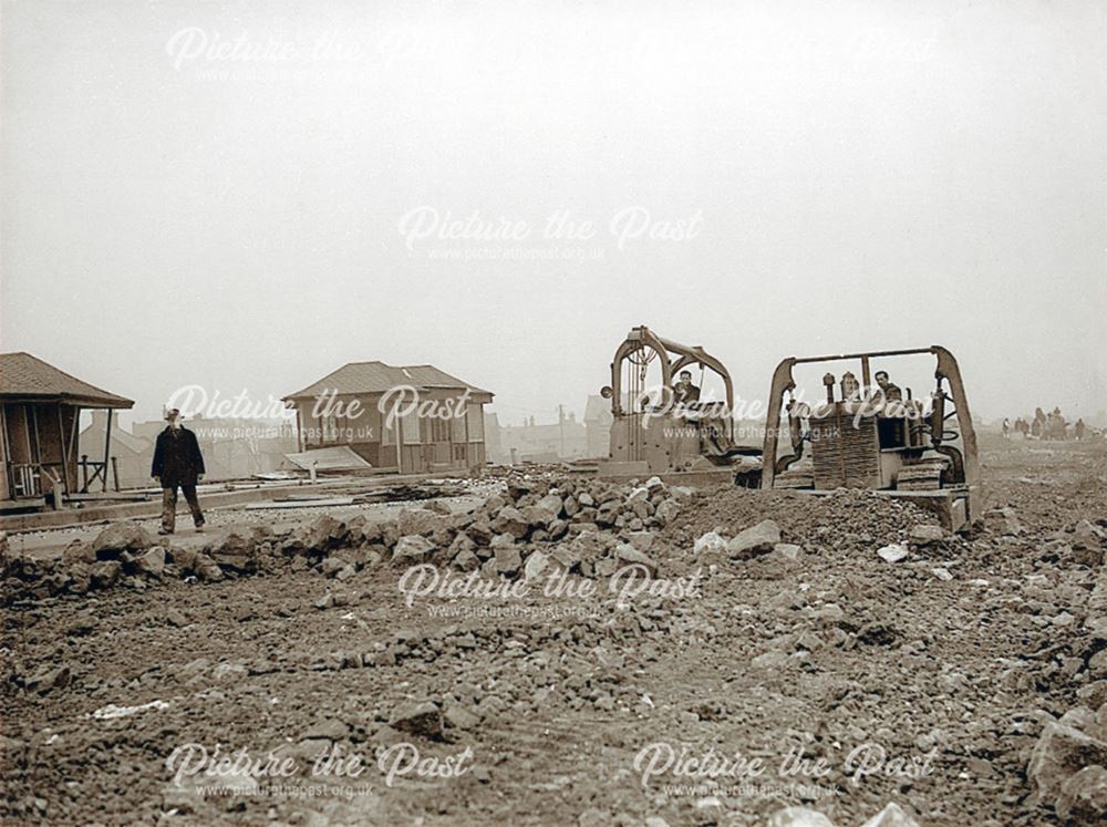 Bulldozers clearing rubble (after the floods of 1952 ?)