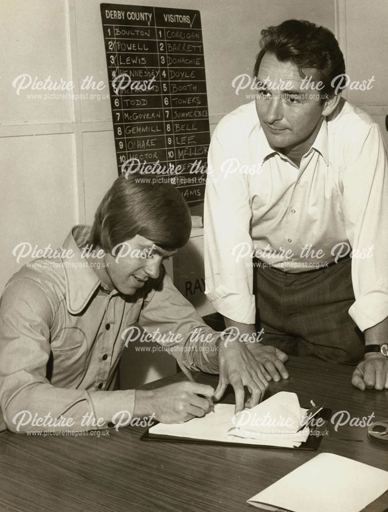 David Nish signs for Derby County F.C., watched by Manager Brian Clough