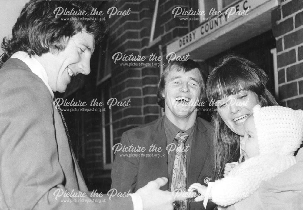 Colin Boulton, His wife and baby with Roy Mcfarland at Derby County Football Club, 1970s