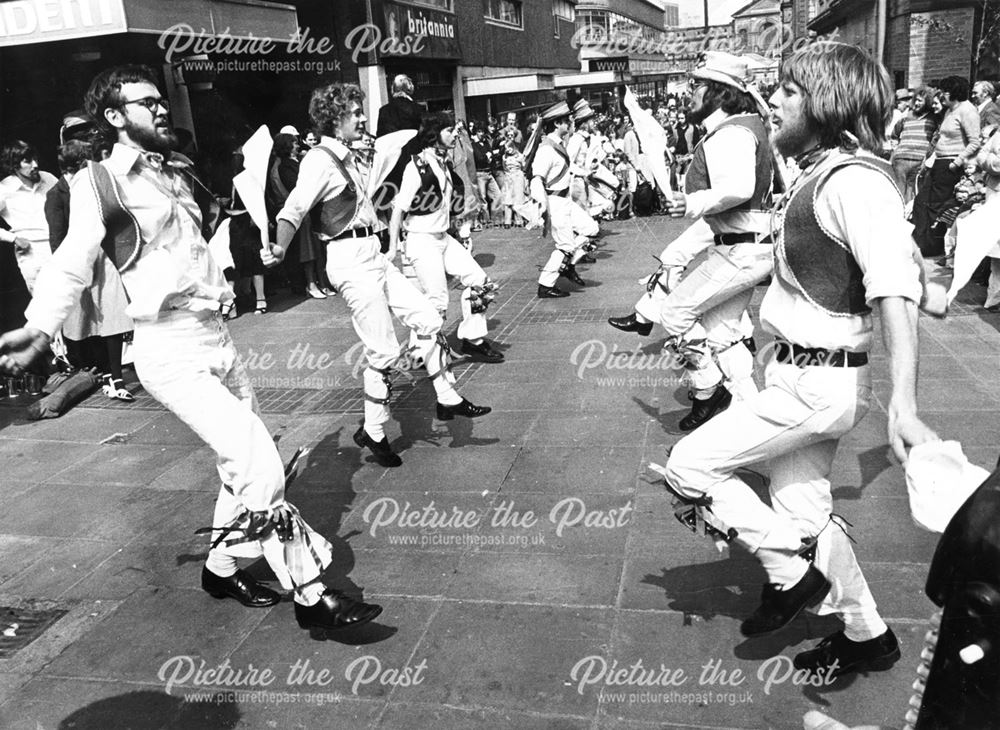 members of Derby, Doncaster and Bangor morris dance teams, dancing in Albert Square.