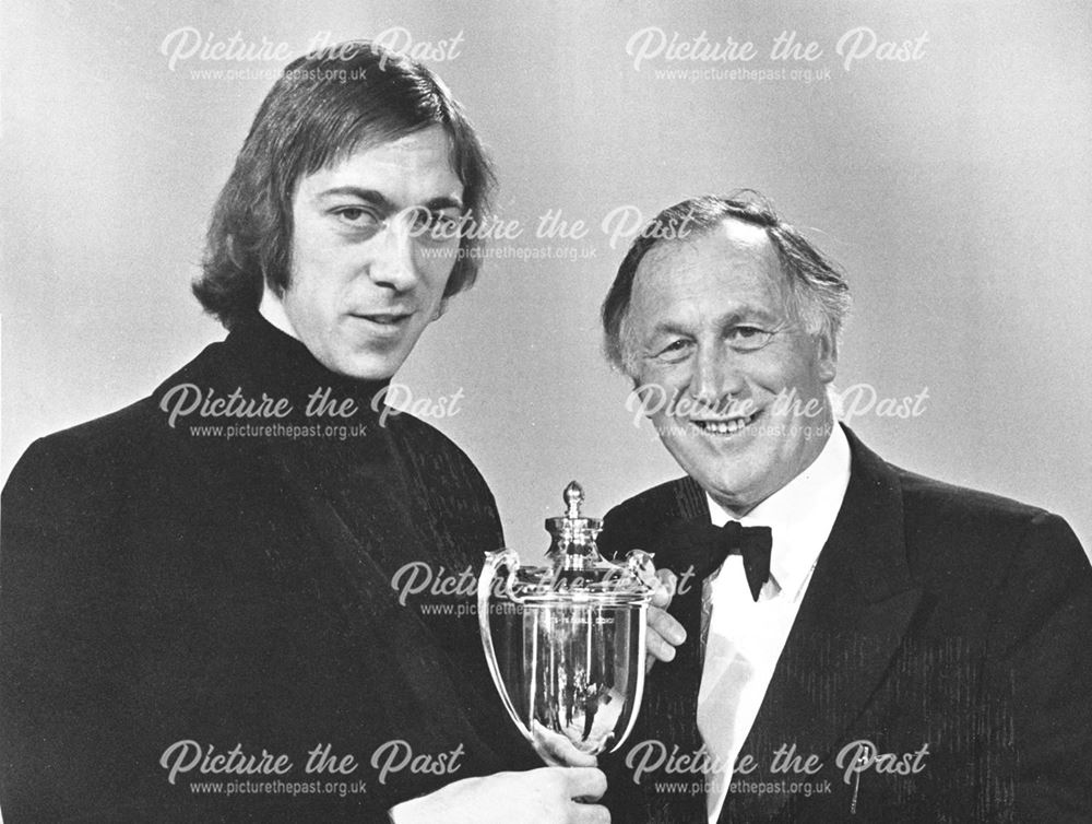 Joe Mercer and Charlie George with his Midland Player of the Year Cup (1975-76), 1976