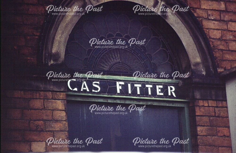 Ornate leaded glass fanlight and sign at No. 12, St Helen's Street