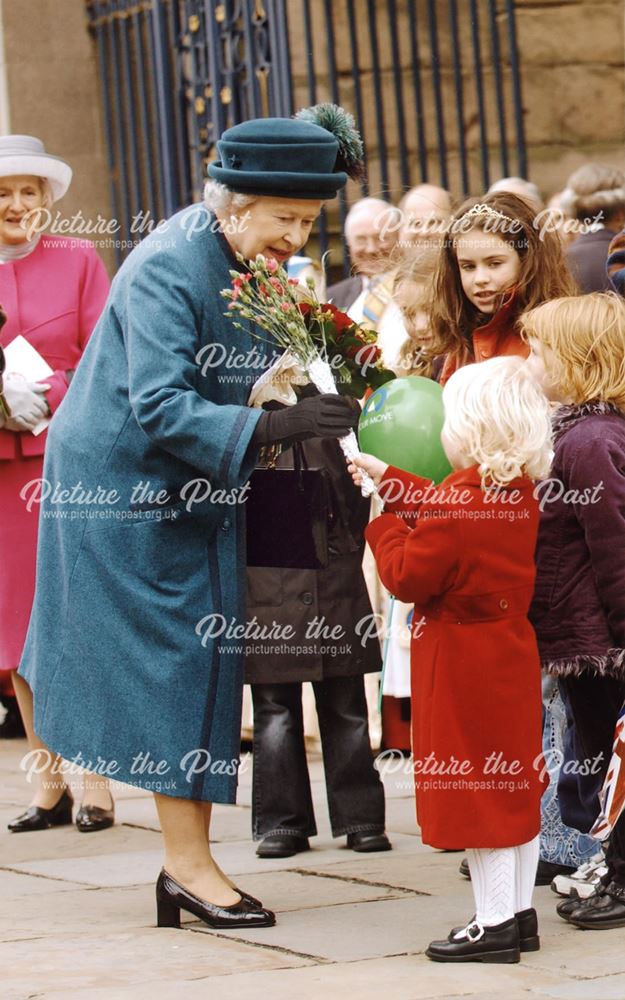 The Queen receiving flowers outside Derby Cathedral