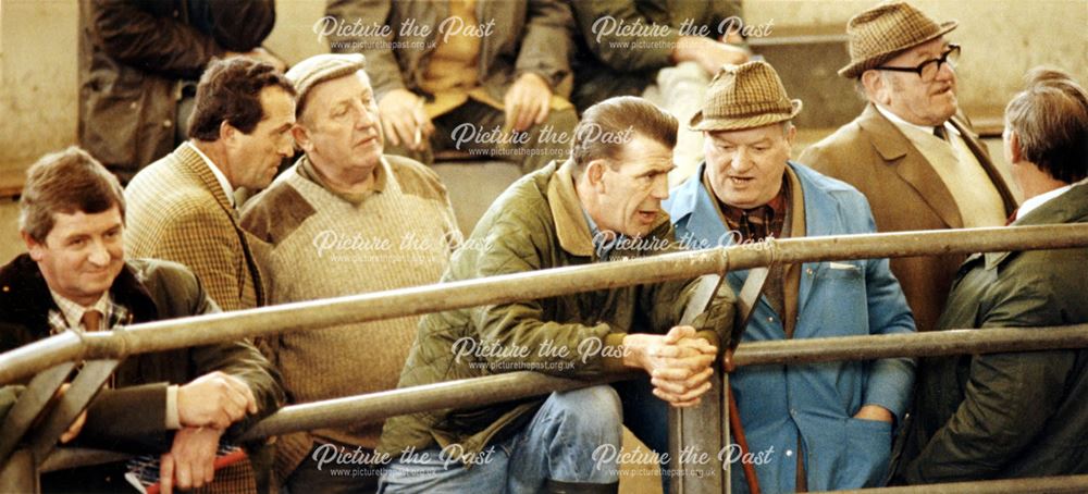 Farmers in conversation, the auction Room at the Cattle Market, Chequers Road