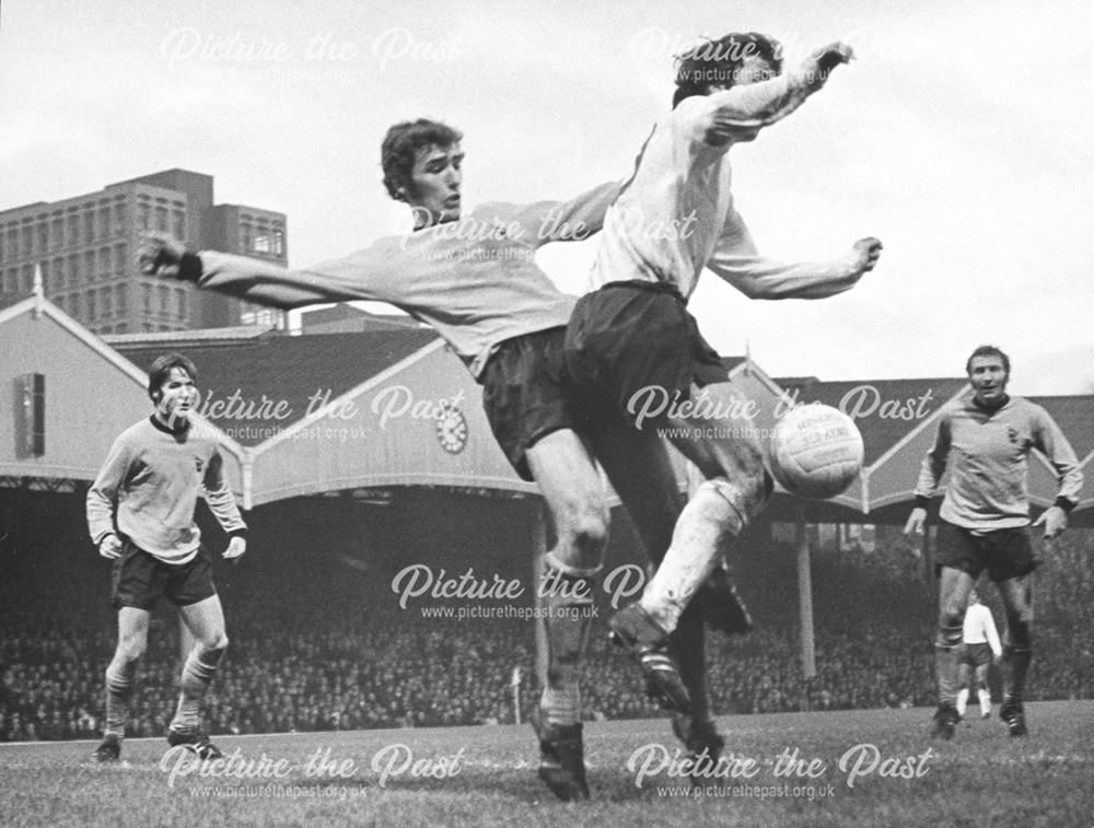 Kevin Hector tangles with Wolves' John McAlle at Wolverhampton, 1971