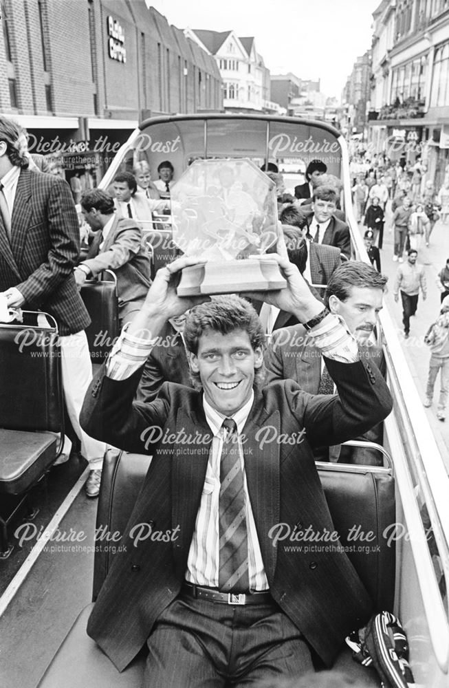 Derby County Skipper Rob Hindmarch holds the trophy in the Rams parade through Derby after being cro