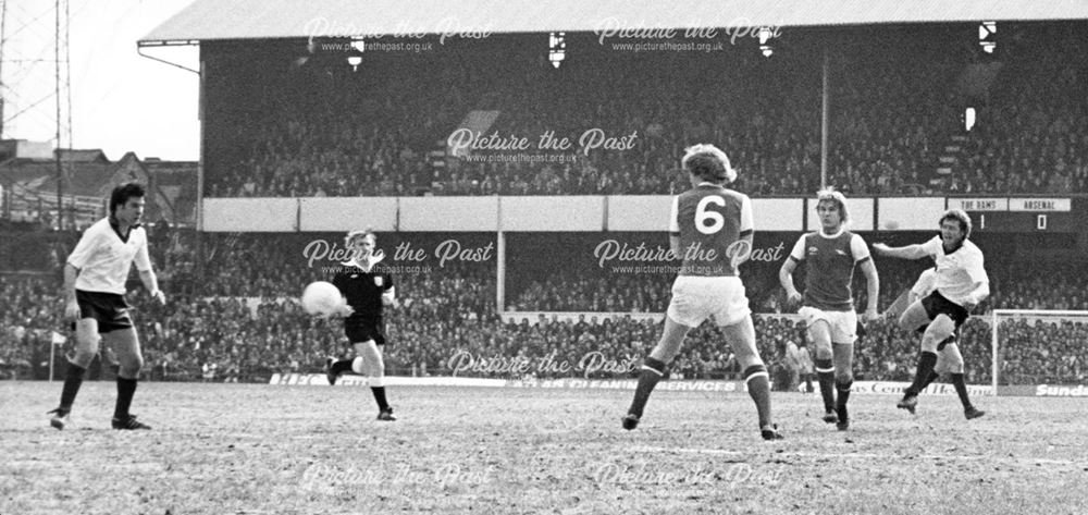 Derby County left-back Steve Buckley scores against Arsenal