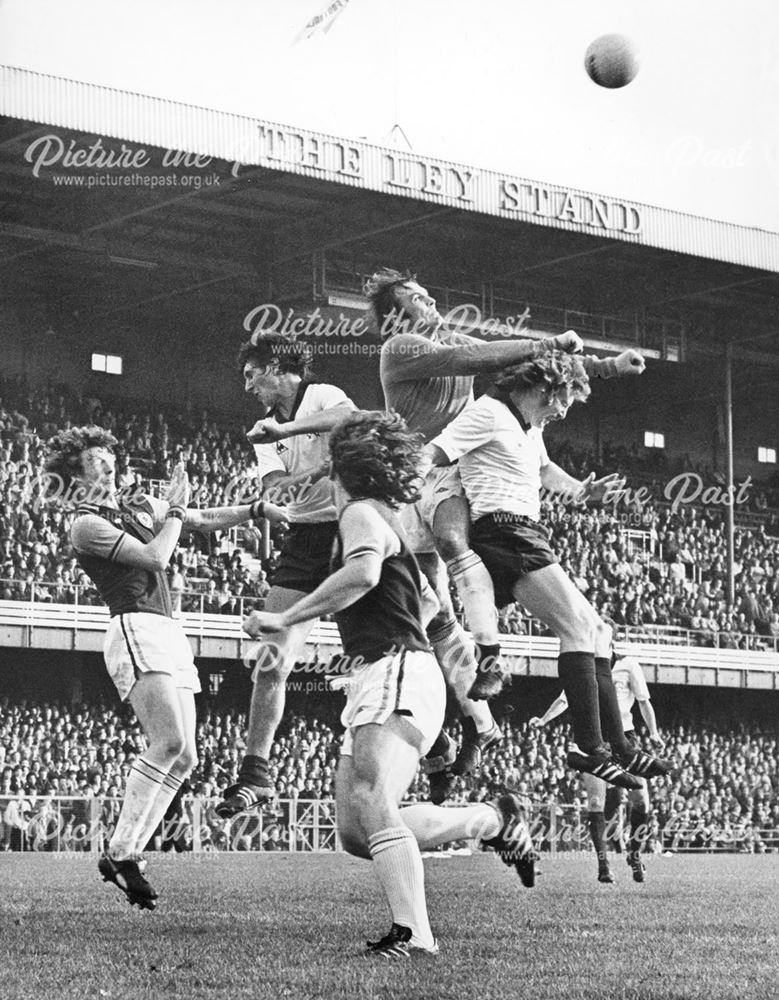 Derby County's Roger Davies and Vic Moreland try to win the ball