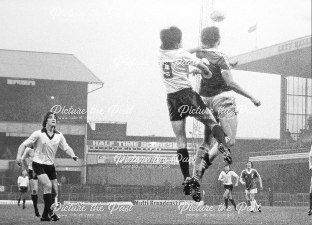 Derby County's Billy Caskey jumps for a high ball