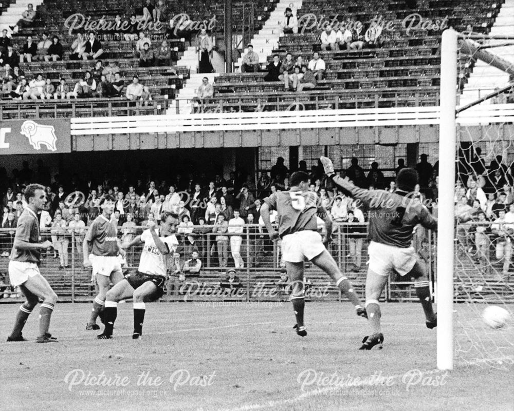 Derby County striker Paul Goddard scores