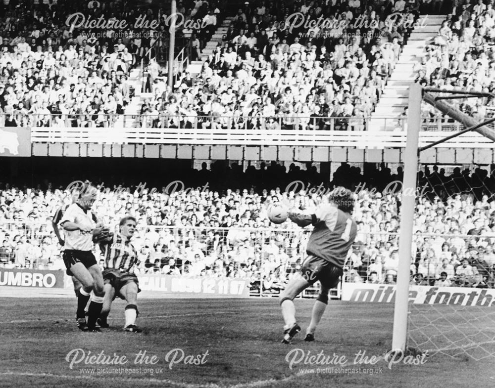 Derby County striker Paul Goddard scores