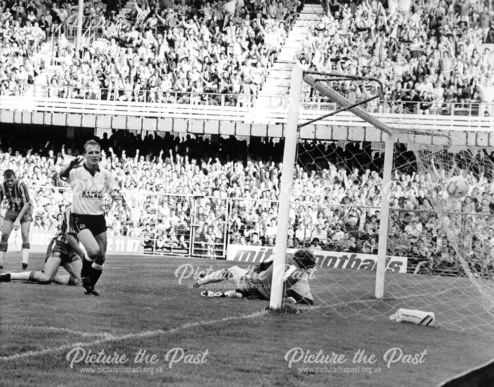 Derby County striker Paul Goddard celebrates a goal