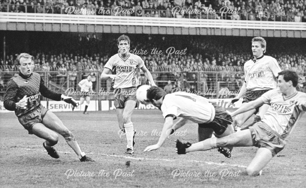 Derby County's David Penney heads the ball