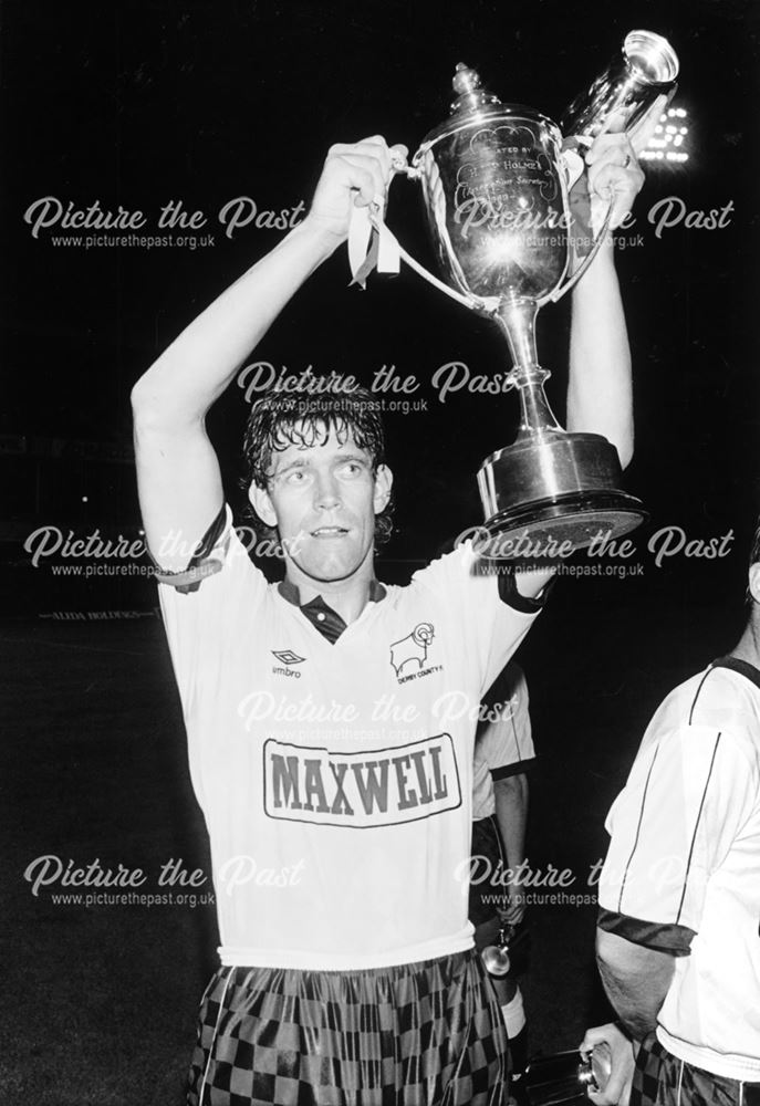 Derby County captain Rob Hindmarch lifts the Derbyshire Centenary Cup