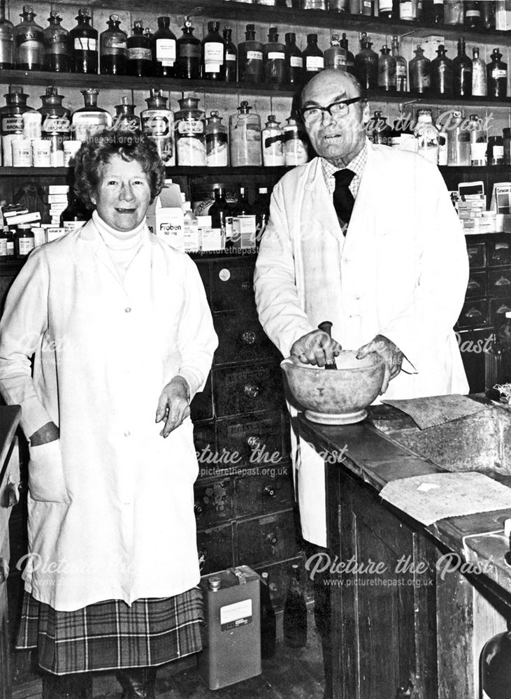 Mr and Mrs Brittain in their chemist shop