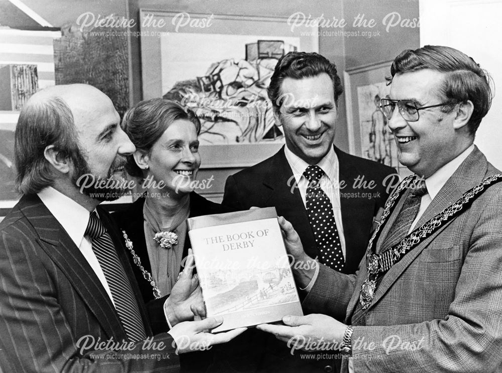 Anton Ripon gives no. 1 of a special edition of 'The Book of Derby' to the Mayor John Thorpe