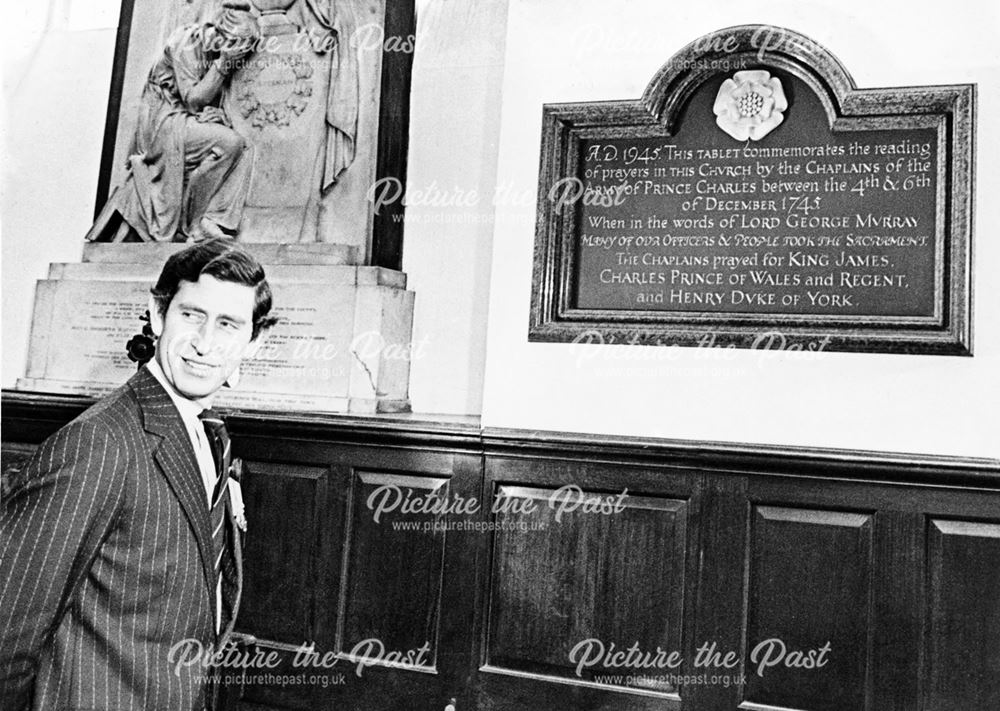 Prince Charles views the plaque for the armies of his namesake 'Bonnie Prince Charlie' in Derby Cath