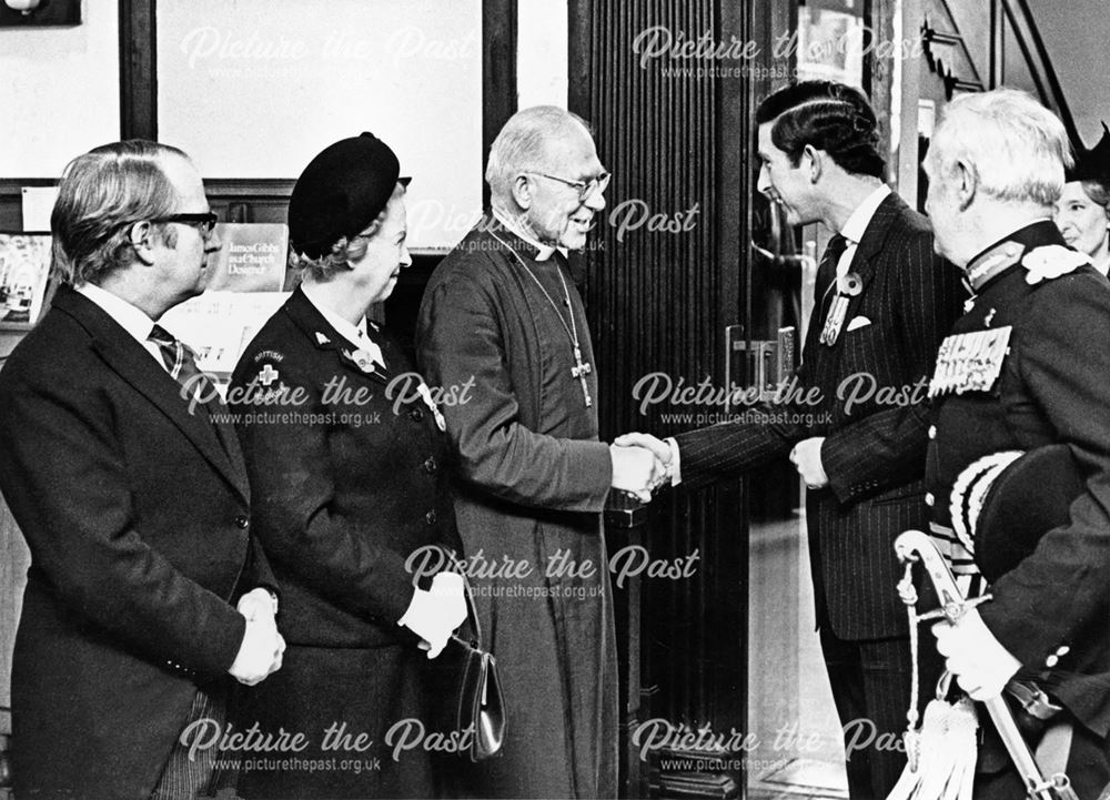 Prince Charles is presented to the Bishop of Derby in Derby Cathedral