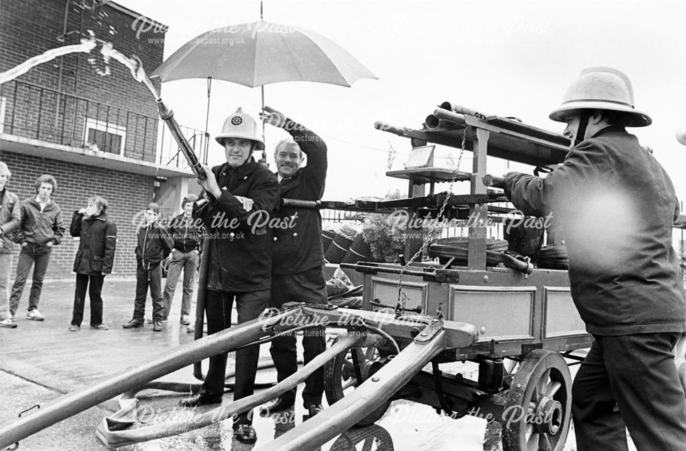 Firemen operating a 200 year old pump