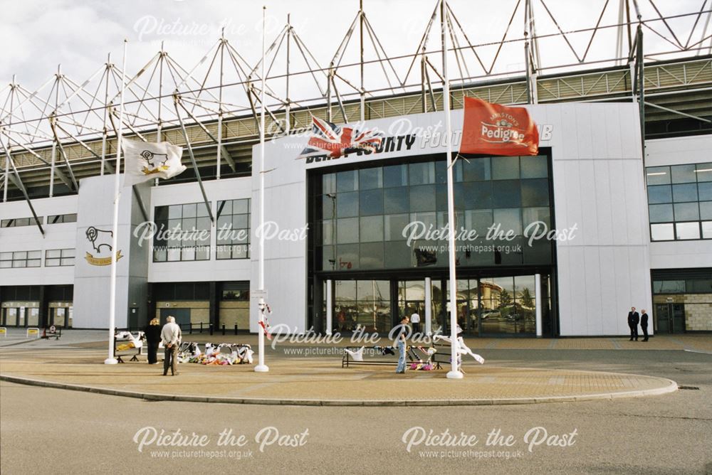 Tributes and half-mast flags outside Pride Park Stadium on the day after Brian Clough's death.