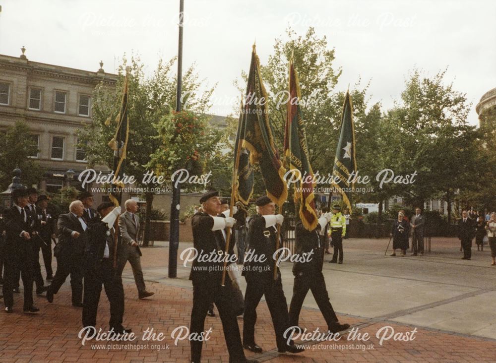 Former Worcestershire and Sherwood Foresters march past the War Memorial