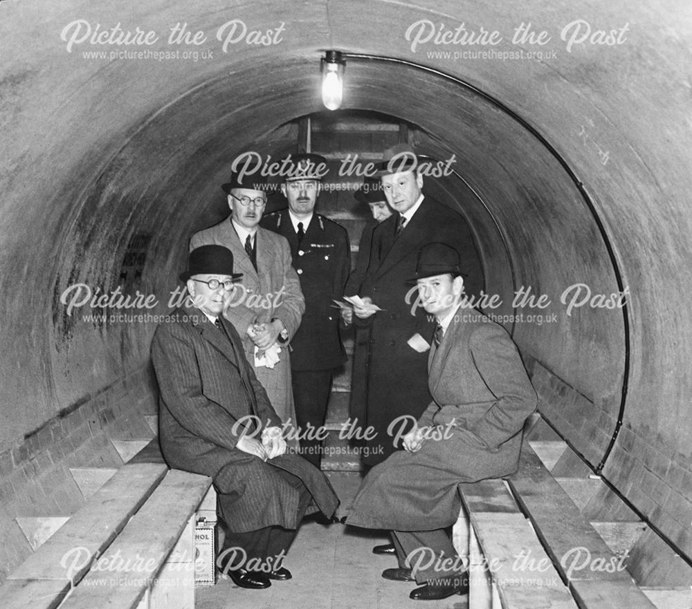 Inspection of a public Air-Raid shelter by dignitaries, during World War 2