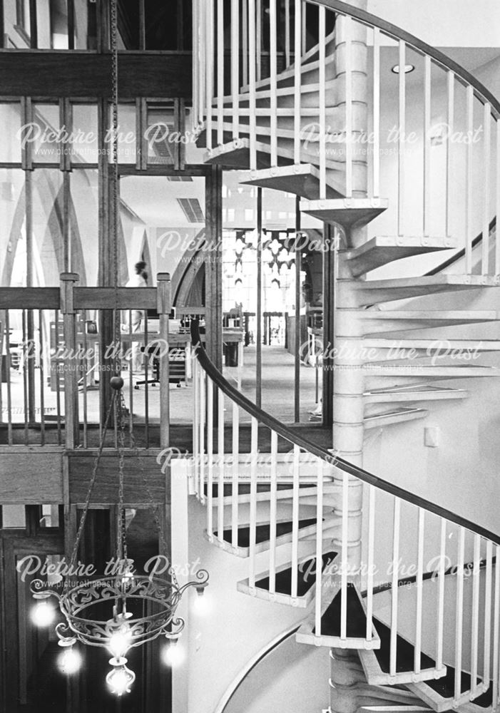 Spiral staircase in St. Michael's Church converted for commercial use to Derek Latham Architects