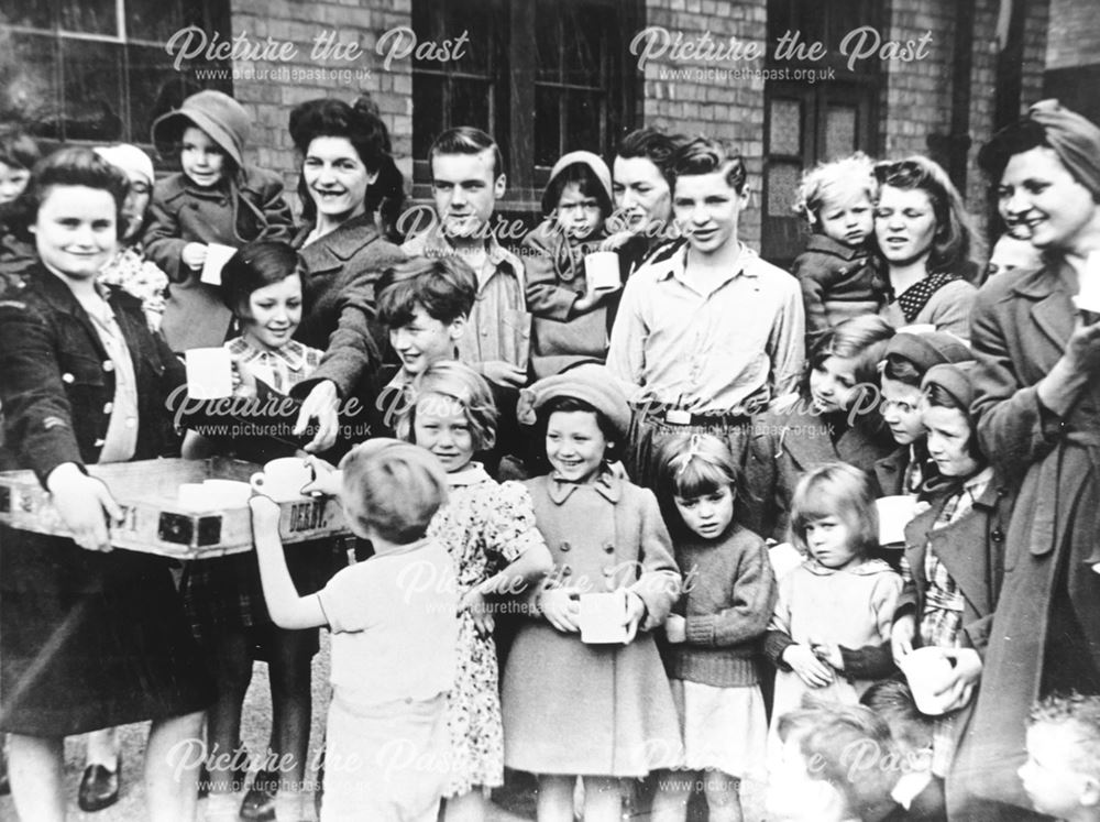 Mothers and children being given tea - War Evacuees