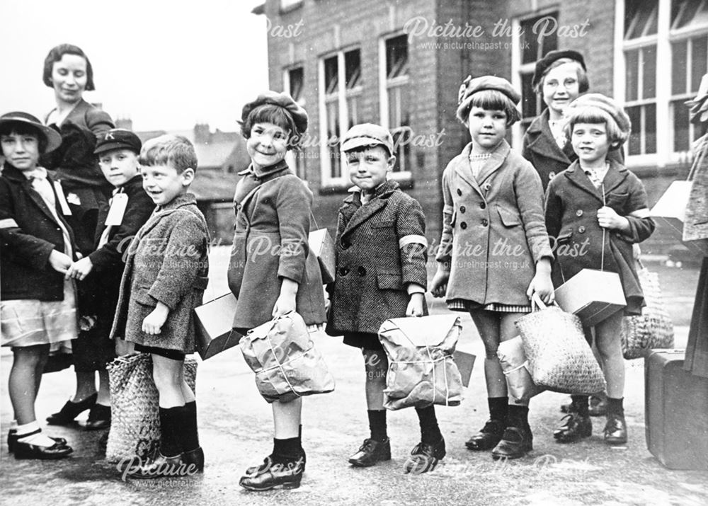 Child war evacuess waiting in line for transport