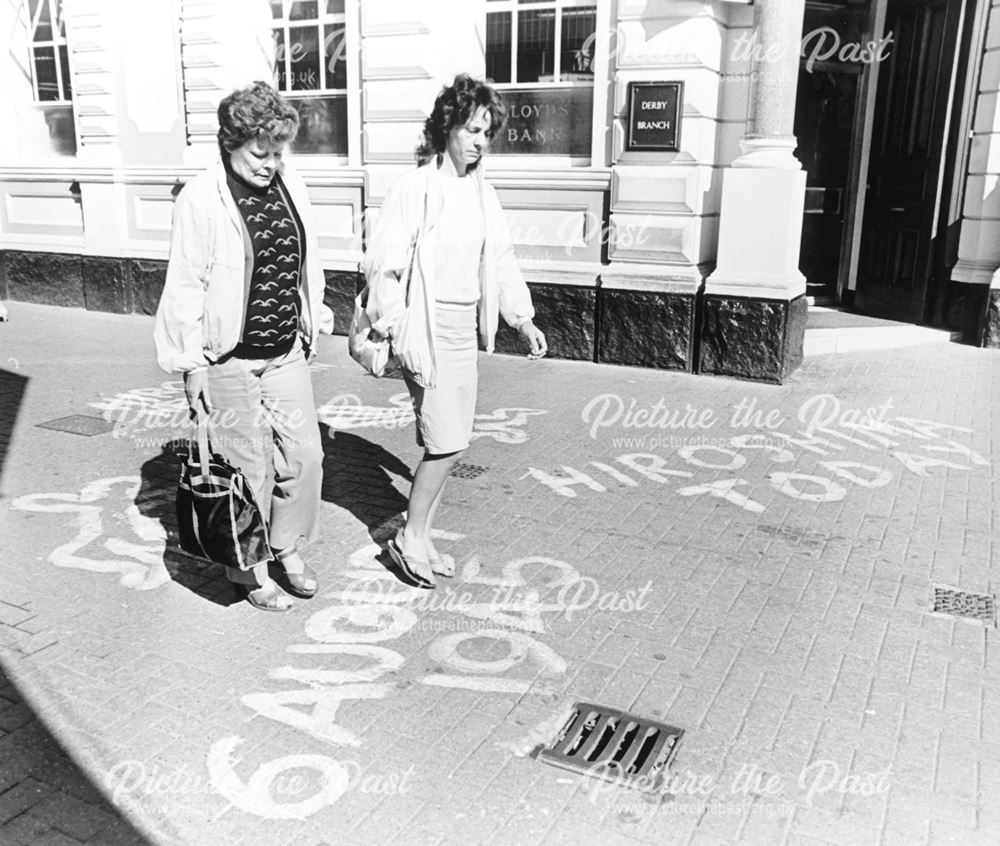 Symbolic pavement signs on Sadlergate, for an Hiroshima anniversary